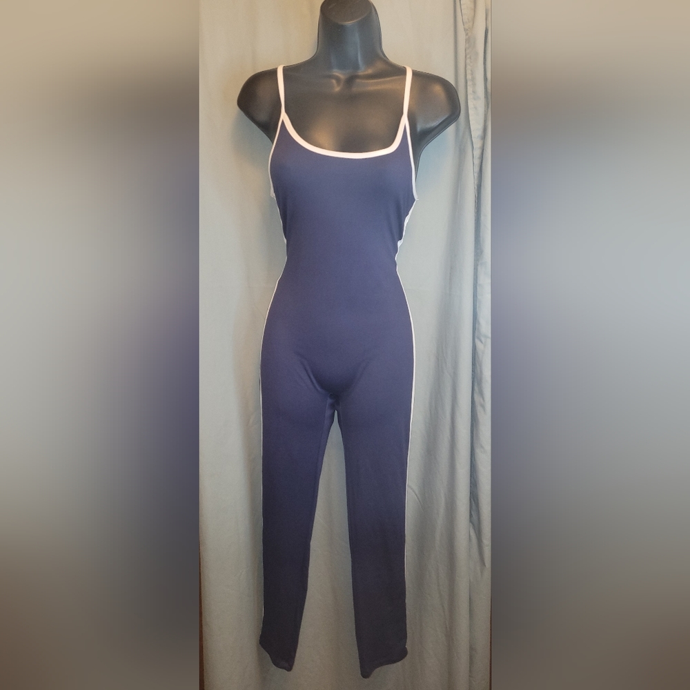 Sleeveless navy blue jumper with spaghetti straps, trimmed in white. NWT.